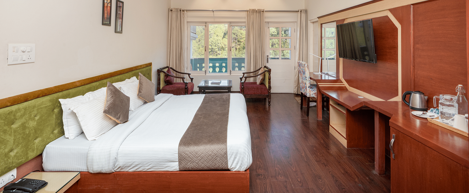 Image of a room at DLS Tehri Club Resort offering a relaxing space with a comfortable bed and seating.